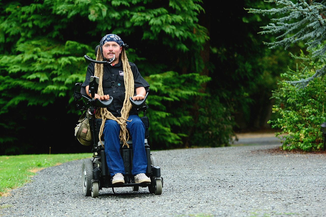 Agnew resident Ian Mackay, who is paralyzed from the neck down, rode his wheelchair 300 miles from Port Angeles to Portland, Ore. this month to highlight the need for accessible trails. (Jesse Major/Peninsula Daily News)