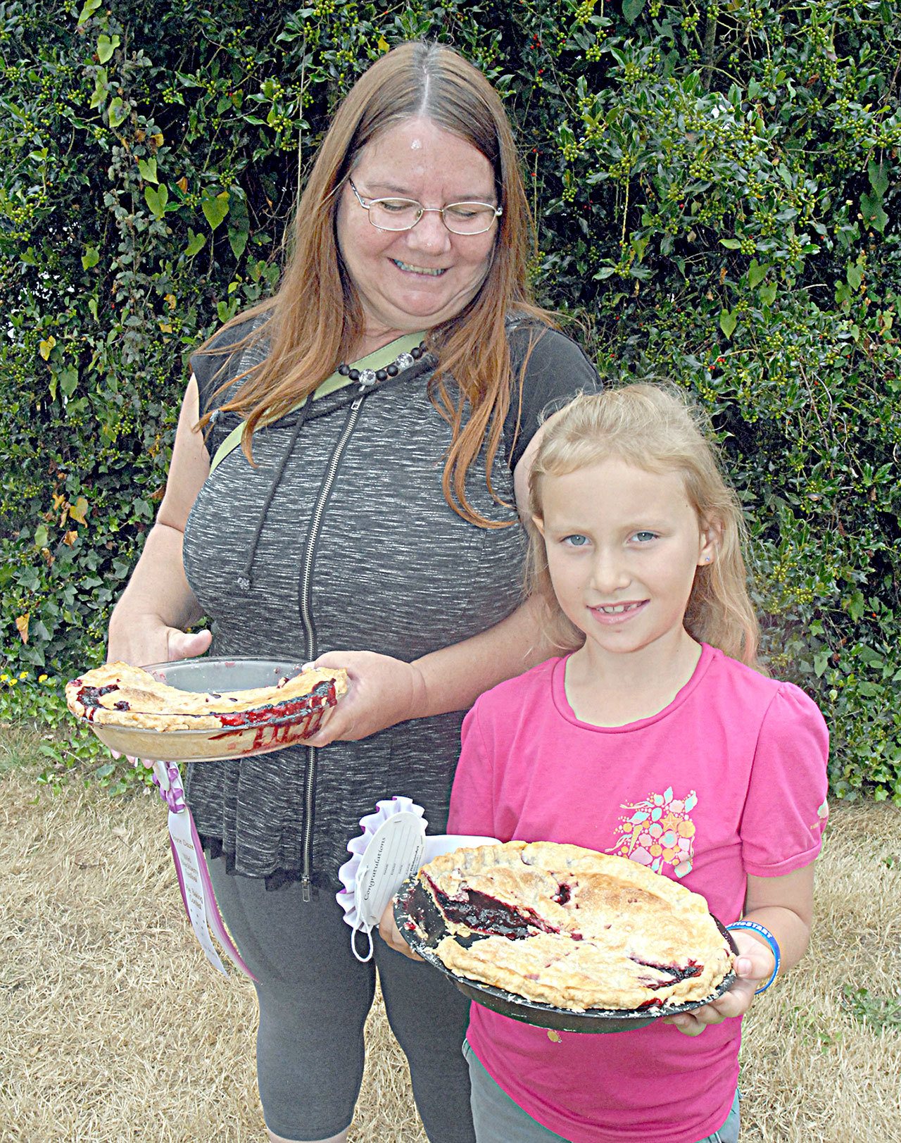 First-place winners in the adult and youth categories of the Joyce Daze Wild Blackberry Festival pie contest were Linda Dechant and her granddaughter, Lily Robertson, 8. (Keith Thorpe/Peninsula Daily News)