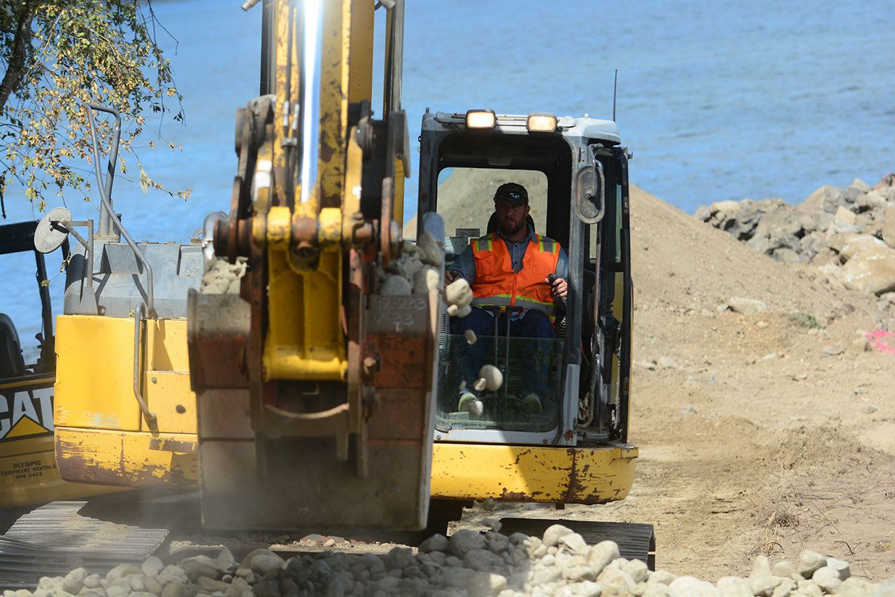 Crews work on the shoreline restoration project at Fort Townsend State Park on Monday. The project will improve beach access to the public and provide wildlife habitats. (Jesse Major/Peninsula Daily News)