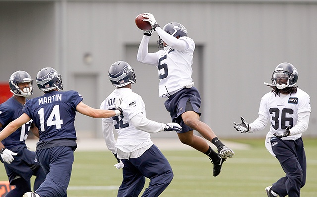 The Associated Press                                Seattle Seahawks’ DeShawn Shead (5) intercepts a pass in a crowd during a 2012 Seahawks practice. Shead competed in the decathlon at Portland State University and may be the team’s best all-around athlete.