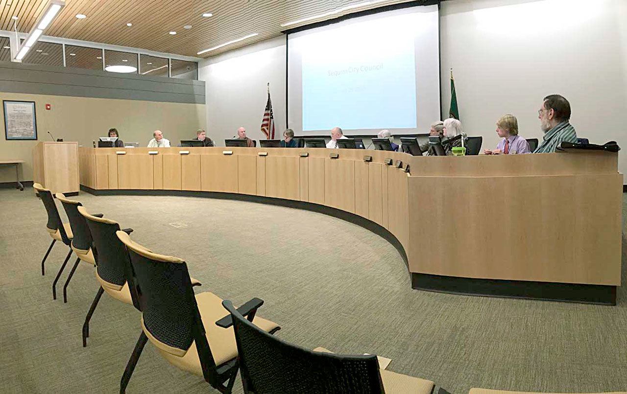 The Sequim City Council, seen in council chambers earlier this year, agreed Aug. 8 to include $15,000 in next year’s budget for video equipment and installation so that meetings can be broadcast live and archived on the city of Sequim’s website. (Matthew Nash/Olympic Peninsula News Group)