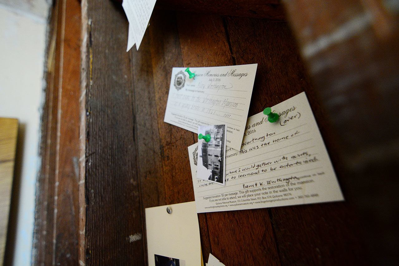 Memories and Messages hang inside the Worthington Mansion in Quilcene. The Quilcene Historical Museum had community members write memories about the historic house. (Jesse Major/Peninsula Daily News)