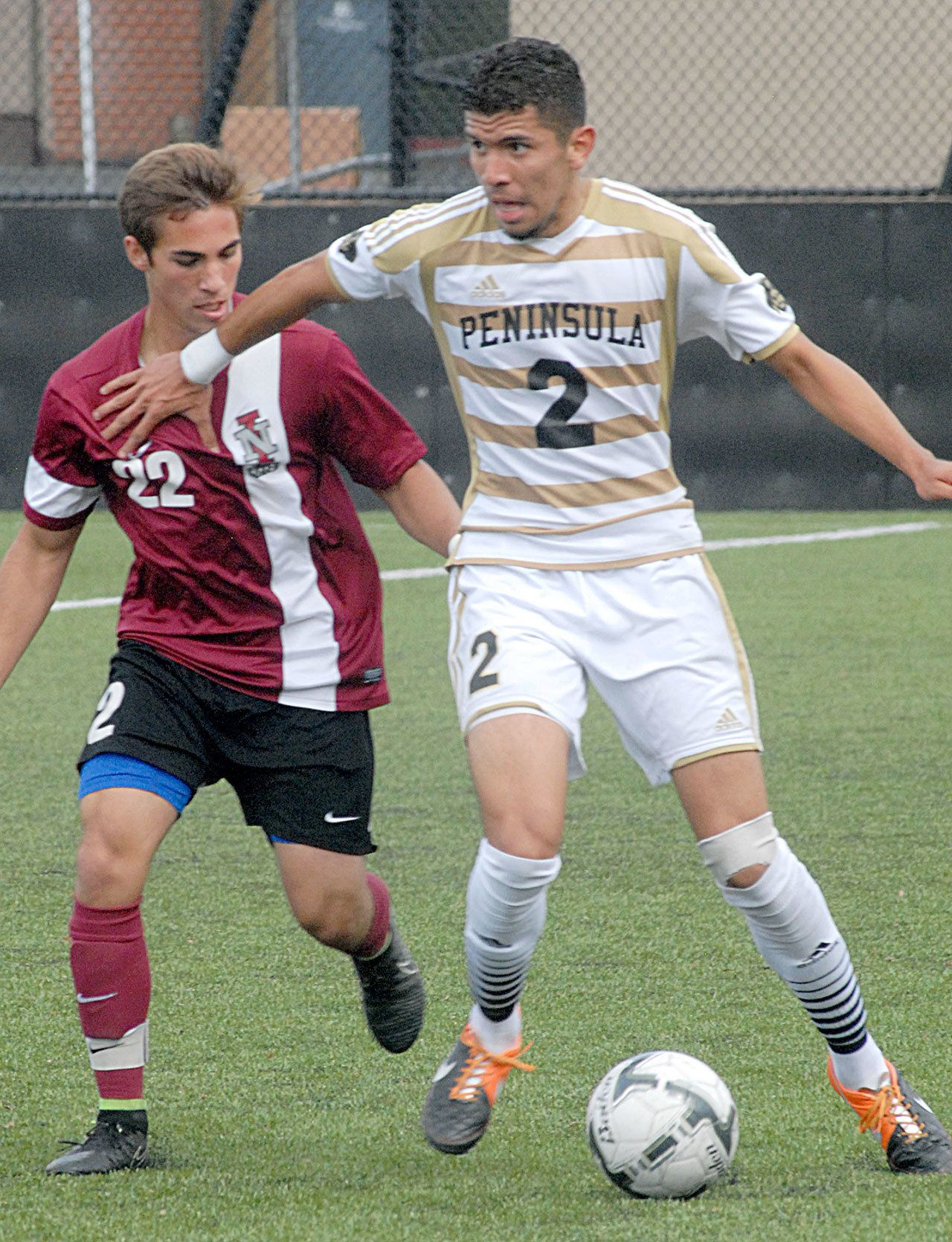Keith Thorpe/Peninsula Daily News Peninsula&rsquo;s Jose Soto, right, plays in a September 2015 game against Northern Idaho.