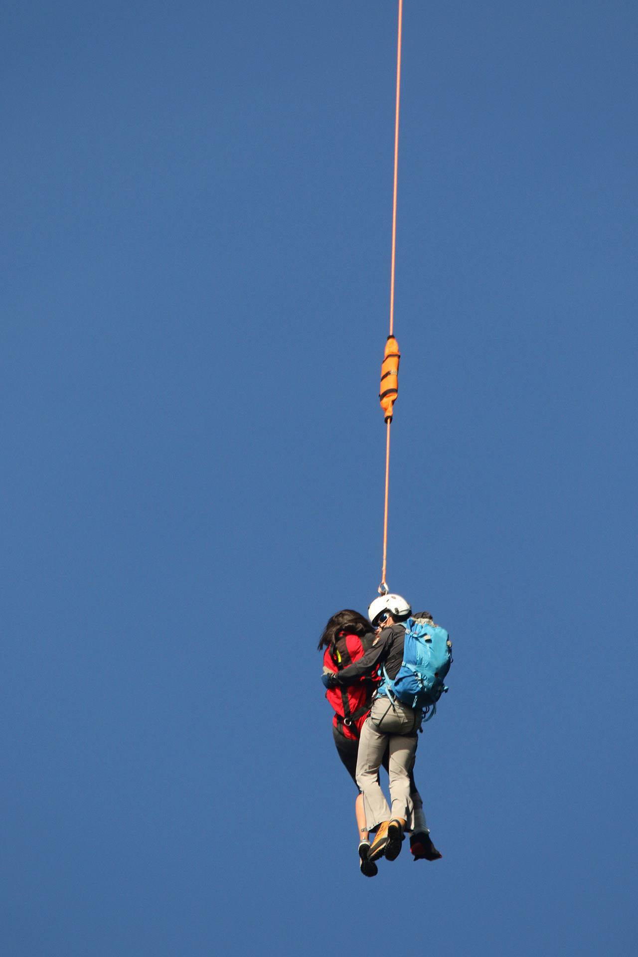 Anita Benitez of Port Angeles is hoisted to safety by a Mount Rainier National Park helicopter crew. (William Morris)
