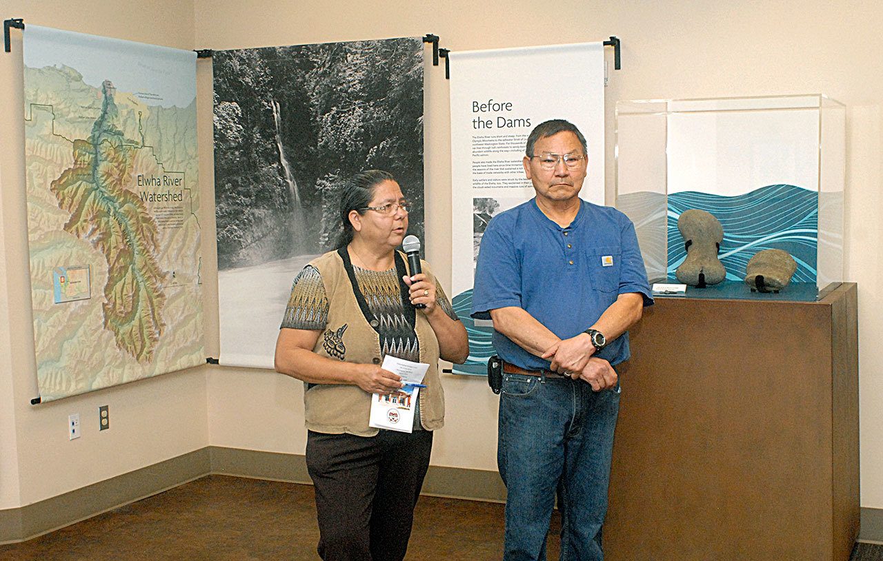 Lower Elwha Klallam Tribal Chairwoman Francis Charles, left, and Robert Elofson, the tribe’s river restoration director, speak Thursday at the opening of a new exhibit on the Elwha River and dam removal at the Elwha Klallam Heritage Center in Port Angeles.(Keith Thorpe/Peninsula Daily News)                                Lower Elwha Klallam Tribal Chairwoman Francis Charles, left, and Robert Elofson, the tribe’s river restoration director, speak Thursday at the opening of a new exhibit on the Elwha River and dam removal at the Elwha Klallam Heritage Center in Port Angeles.(Keith Thorpe/Peninsula Daily News)