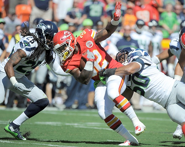 The Associated Press Kansas City Chiefs running back Spencer Ware (32) is tackled by Seattle&rsquo;s K.J. Wright (50) and Richard Sherman (25) during the team&rsquo;s first preseason game last week.