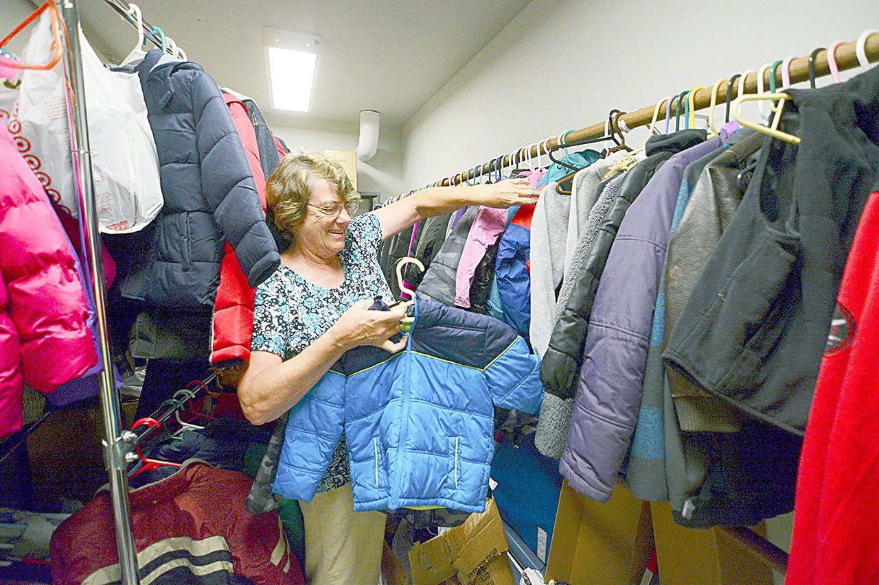 Elma Beary prepares Tuesday for the eighth annual Back to School Clothes Swap, scheduled in the Chimacum Elementary School multipurpose room Saturday. Donations will be accepted today and Friday. (Jesse Major/Peninsula Daily News)