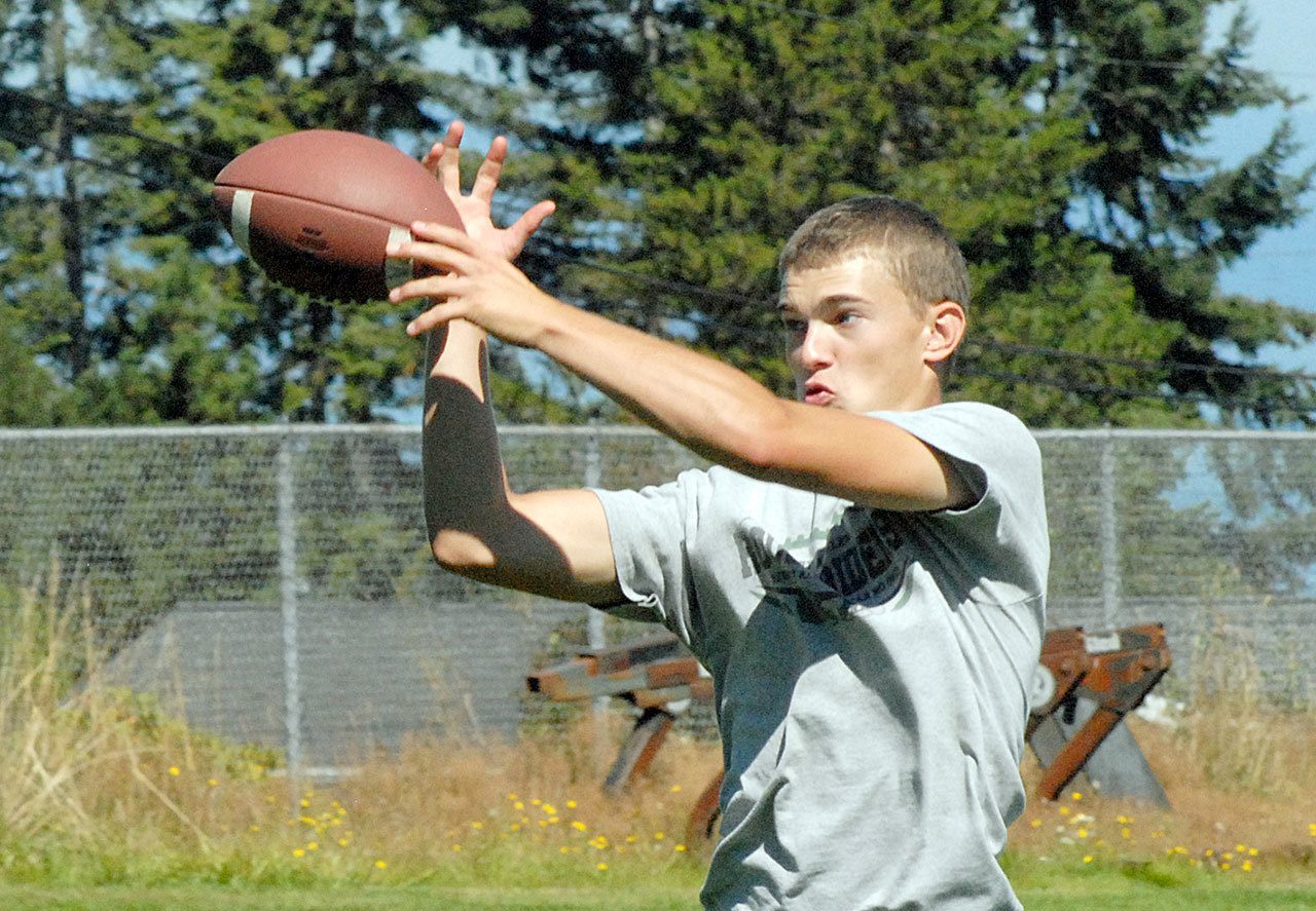 Keith Thorpe/Peninsula Daily News                                Caleb Joslin takes part in a practice for receivers on Wednesday during the first practice for Port Angeles High School.