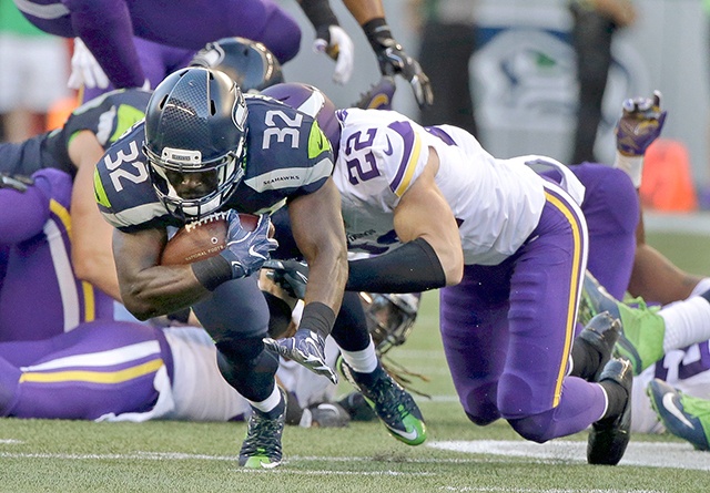 The Associated Press Seattle Seahawks running back Christine Michael (32) is tackled by Minnesota Vikings free safety Harrison Smith (22) during the first half of a preseason NFL football game Thursday, Aug. 18, 2016, in Seattle.