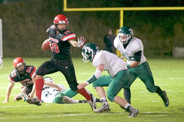 Steve Mullensky/forPeninsula Daily News Port Townsend running back Detrius Kelsall prepares to stiff arm a Port Angeles defender. Kelsall, a junior, should be the Redhawks&rsquo; primary ball-carrier on offense and a force at linebacker on defense.