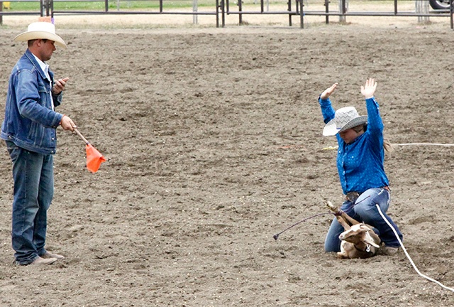 Dave Logan/for Peninsula Daily News Port Angeles’ Amelia Hermann, 12, completes her Junior Girls Goat Tying event in just over 12 seconds at the Peninsula Junior Rodeo Association’s Junior Rodeo. Each participant rides their horse to a waiting goat in the middle of the arena, flips the goat over and ties three legs as fast as they can. More than 100 boys and girls up to age 18 participated in the two-day competition at the Clallam County Fairgrounds.