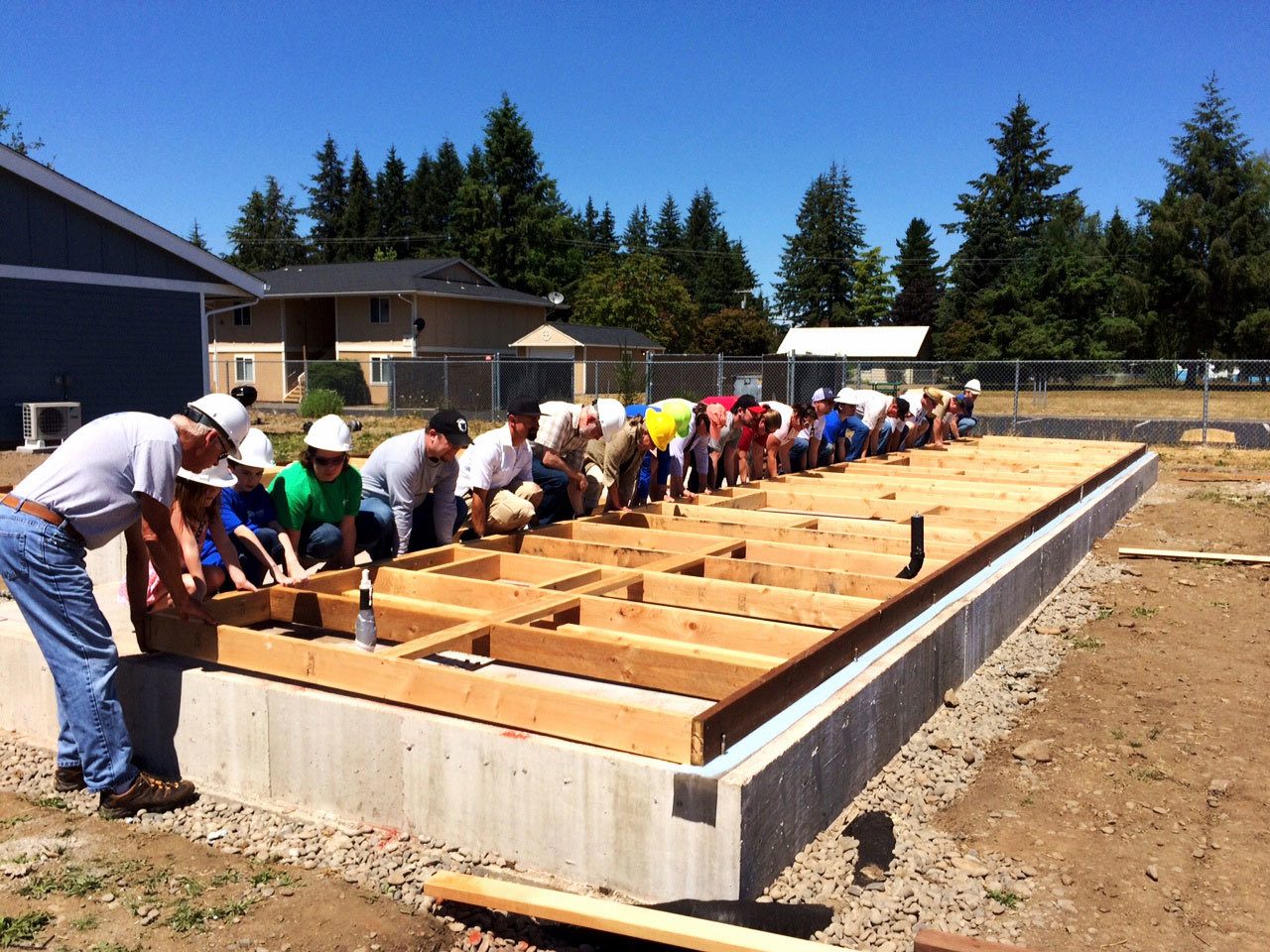 Habitat for Humanity of Clallam County works on building a house in Forks. Habitat has announced it will be taking a two-year hiatus from serving Forks and focusing on a neighborhood revitalization program. (Habitat for Humanity)