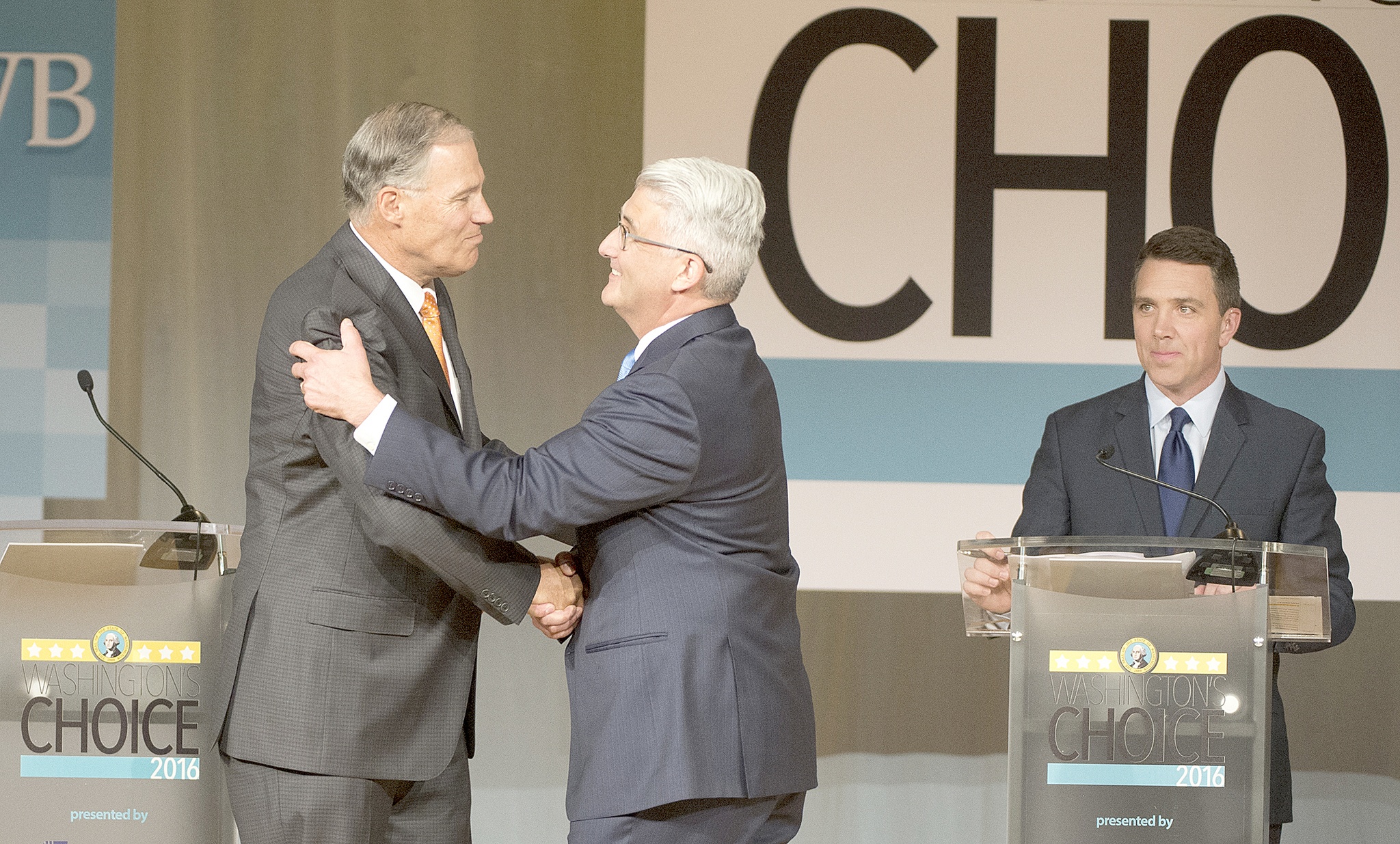 Jesse Tinsley/The Spokesman-Review via AP                                Washington Gov. Jay Inslee, left, shakes hands with challenger Bill Bryant before the two debate at Spokane Falls Community College on Wednesday in Spokane. Moderator Sean Owsley of KHQ-TV stands at right.