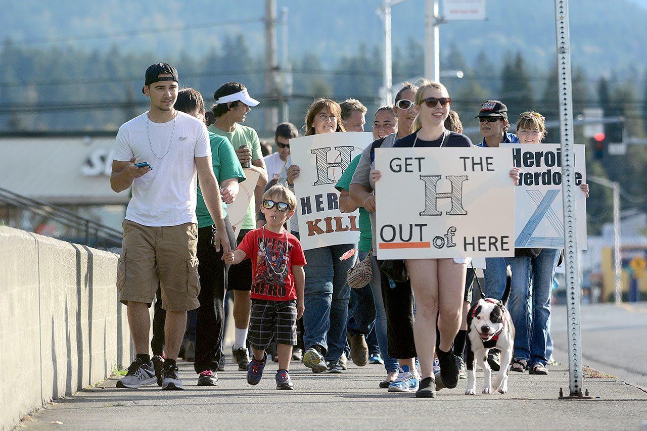 Hundreds walk down Lincoln Street in Port Angeles during an overdose awareness walk Tuesday. (Jesse Major/Peninsula Daily News)