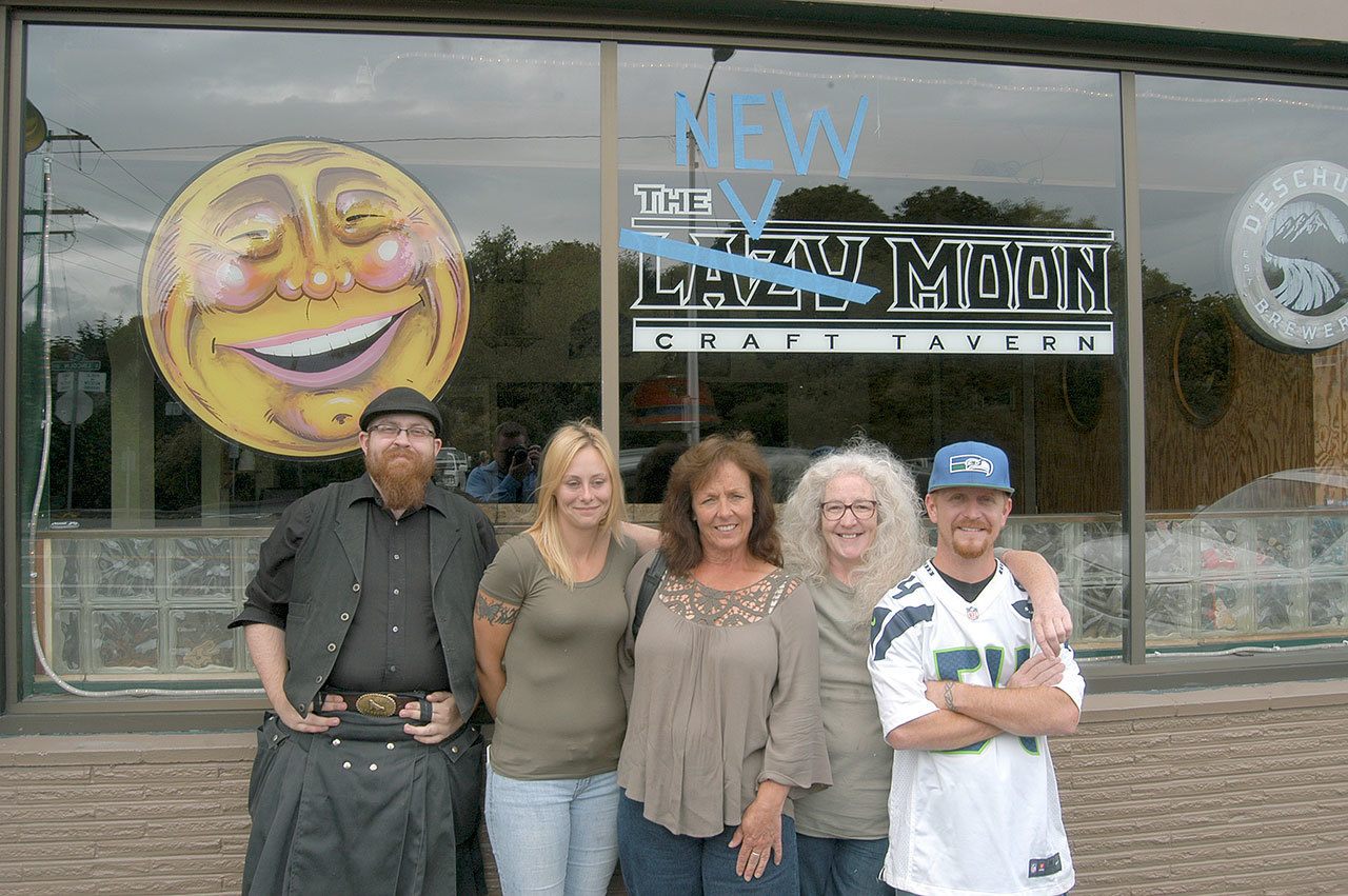 New Moon Craft Tavern staffers Brian Crocker, Becky Nelson, Debby Cargo, Marie McKean and Todd Kain stand outside the former Lazy Moon Craft Tavern in Port Angeles. The bar opens under new ownership at 11:30 a.m. today. (Rob Ollikainen/Peninsula Daily News)
