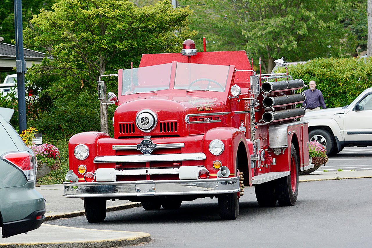 The Port Angeles City Council approved the surplus sale of a 1954 Seagrave fire engine, known as Sparky, to the nonprofit Port Angeles Firefighters Association for $1 during its meeting Tuesday. (Jesse Major/Peninsula Daily News)