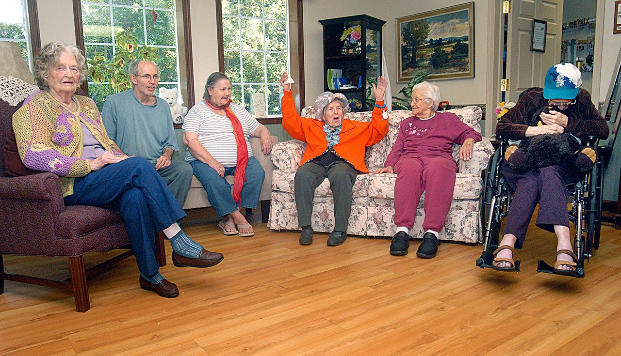 Laurel Place Assisted Living Center residents, from left, Joyce Madison, 86, Craig Donelson, 61, Norma Sue Becker, 89, Lois Draper, 94, Mildred Marie Harris, 95, and Maxine Clark, 103, gather on the eve of taking a tethered balloon ride, scheduled for today at Port Angeles Civic Field. (Keith Thorpe/Peninsula Daily News)