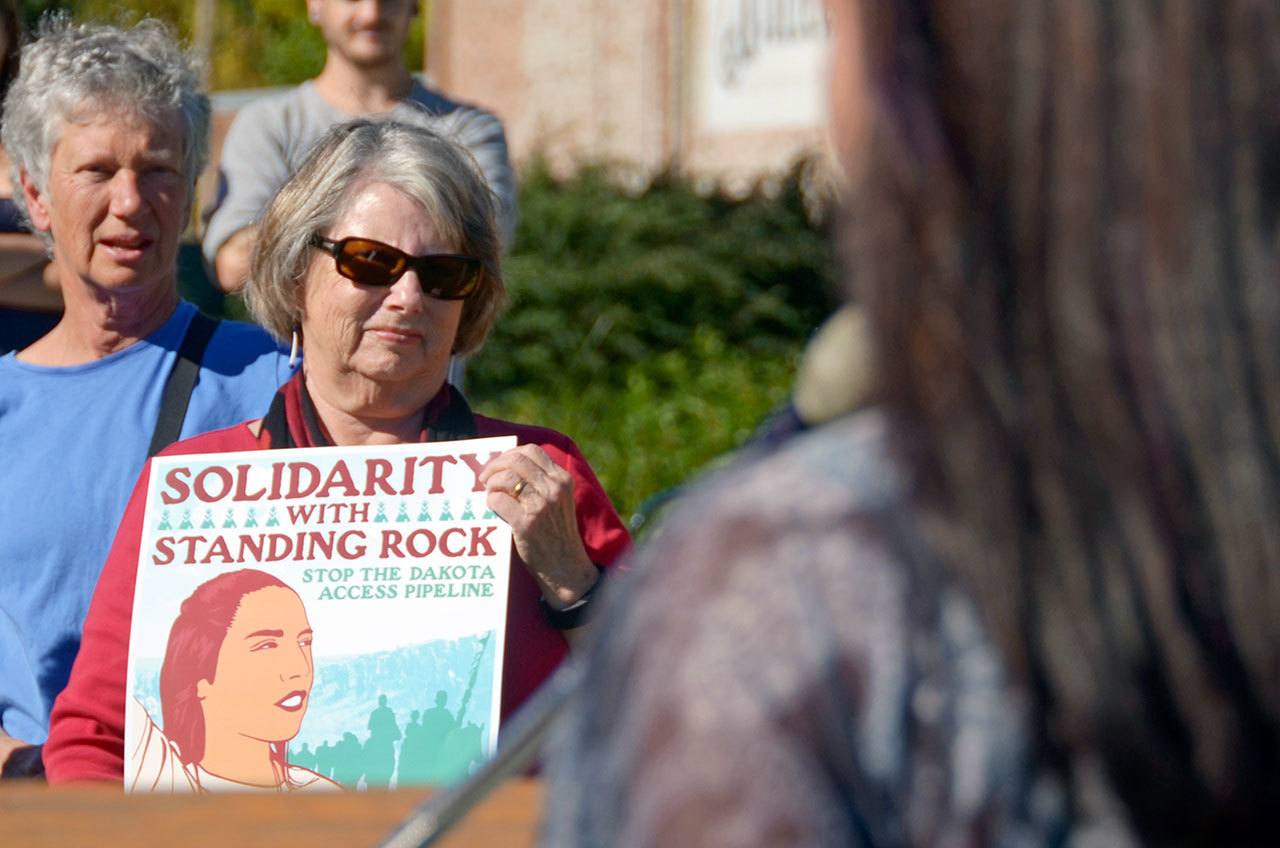 Jo Blair of Port Townsend holds a sign protesting the Dakota Access Pipeline at a rally in Port Townsend on Tuesday. The rally was one of many across the U.S. meant to show solidarity with the Stand Rock Sioux tribe, which is leading protests against the pipeline in North Dakota. (Cydney McFarland/Peninsula Daily News)