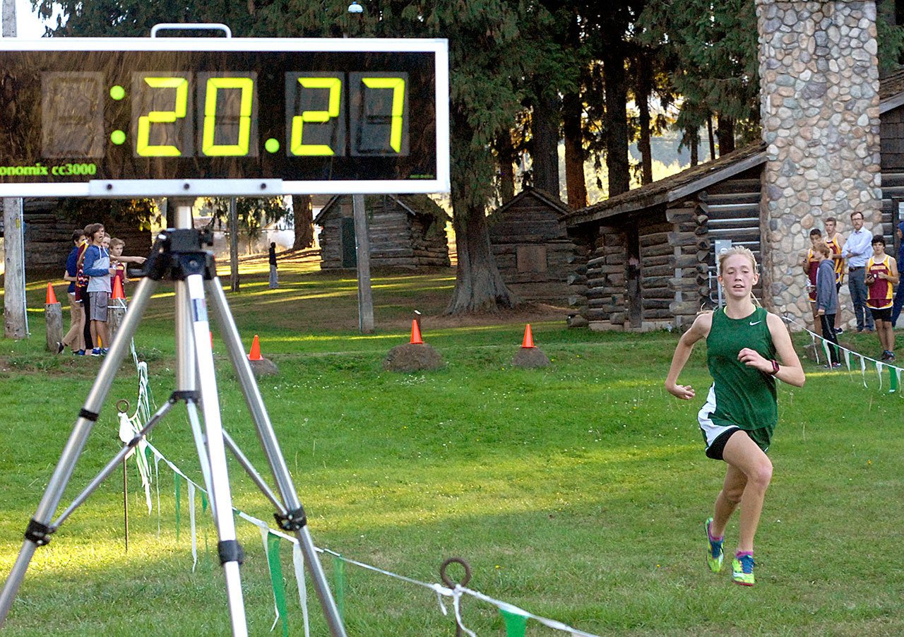 Keith Thorpe/Peninsula Daily News Port Angeles’ Gracie Long sprints towards the finish to win the girl’s race during Wednesday’s three team cross country meet against Kingston and North Mason at Lincoln Park in Port Angeles.