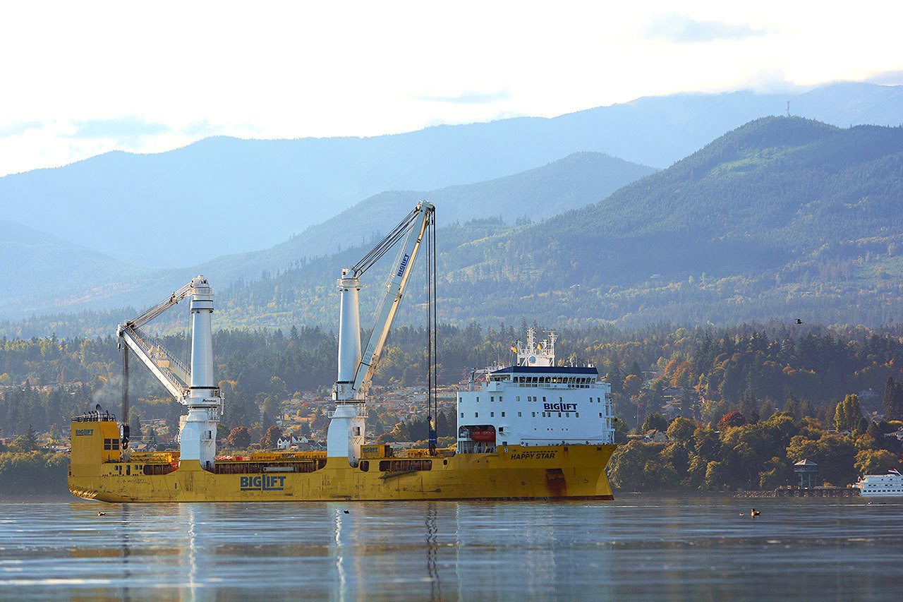 Big Lift Shipping’s MV Happy Star made port in Port Angeles Harbor last week. It is a heavy-lift vessel flying the Netherlands’ flag and is equipped with two 900 metric ton heavy-lift mast cranes geared for handling heavy cargoes, according to the company’s website. (Jesse Major/Peninsula Daily News)