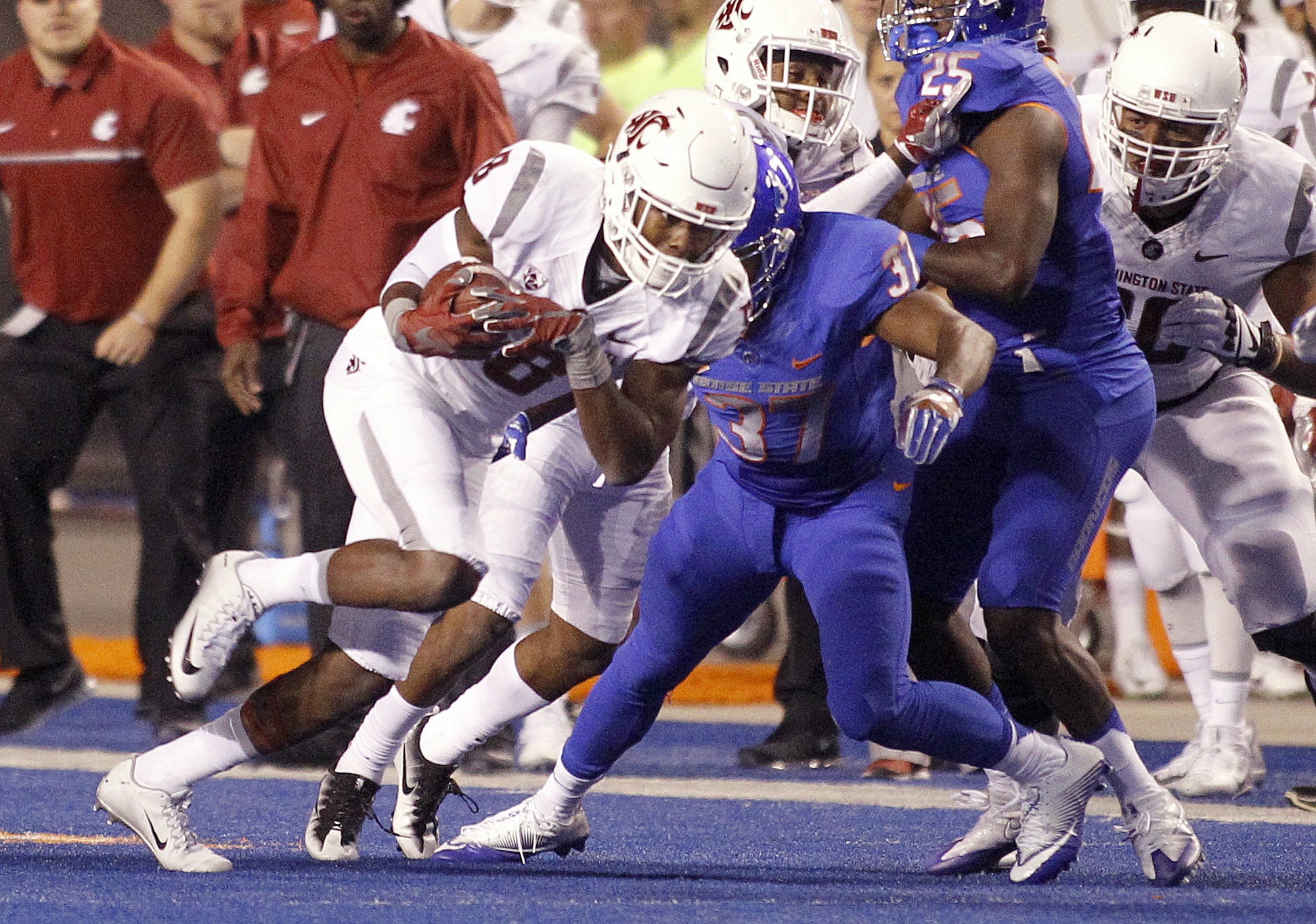 The Associated Press                                Washington State’s Tavares Martin Jr. (8) runs after a catch against Boise State.