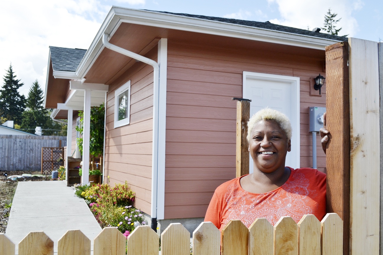 Matthew Nash/Olympic Peninsula News Group                                Eula Cook stands outside her new home in Port Angeles’ Maloney Heights Subdivision. After almost nine years in Sequim, she received assistance through Habitat for Humanity of Clallam County to purchase her own home.