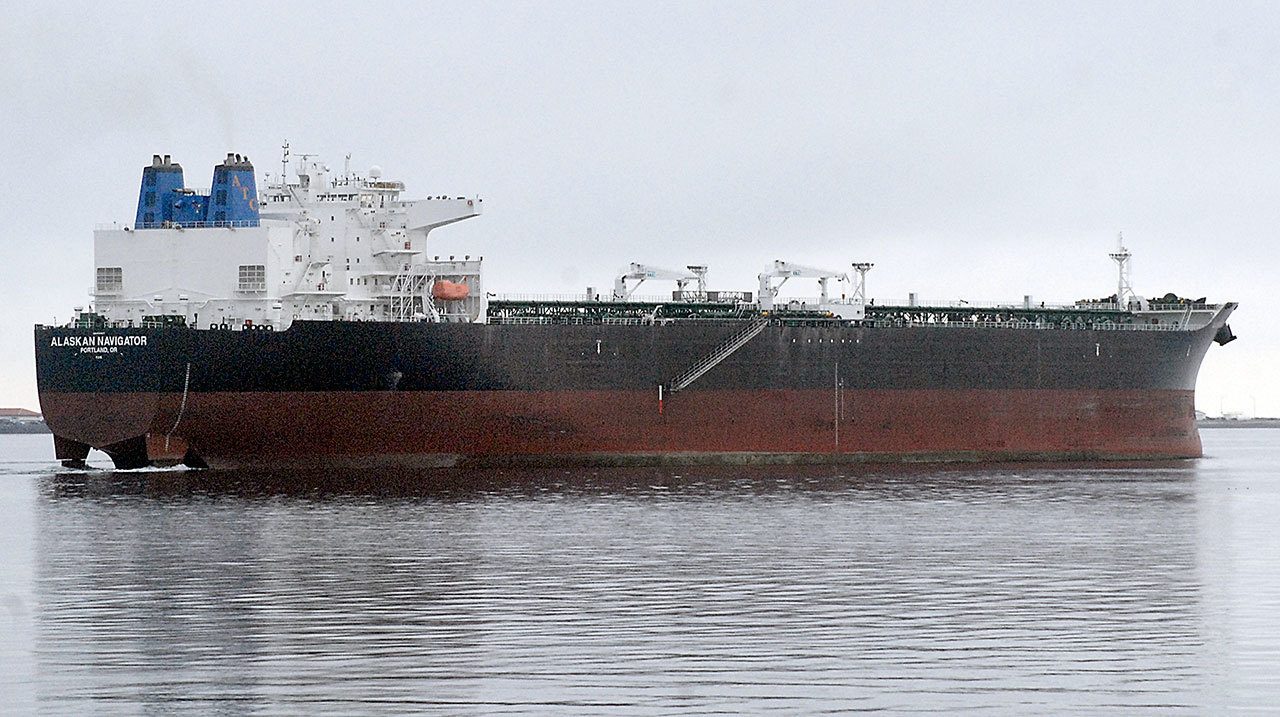 The tanker ship Alaskan Navigator departs Port Angeles on Saturday morning after undergoing maintenance inspection. (Keith Thorpe/Peninsula Daily News)