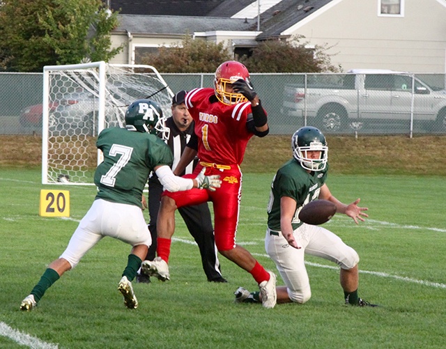 Dave Logan/for Peninsula Daily News                                Port Angeles’ Easton Joslin, right, nearly intercepts a pass intended for Mount Tahoma’s Ira Branch (1), as Roughriders’ teammate Rudy Valdez watches during a game last month.