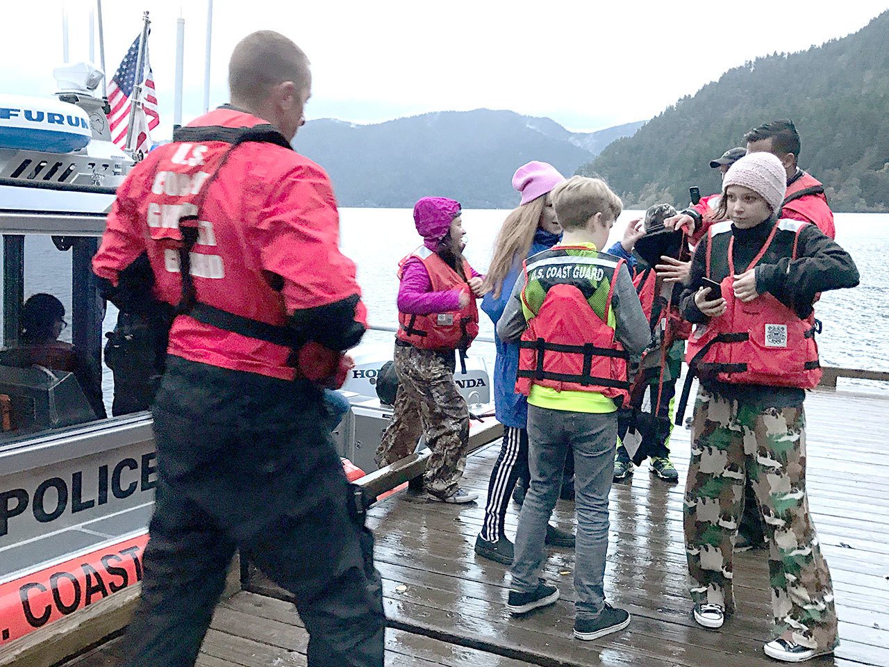 A Coast Guard Station Port Angeles boat crew assists in the rescue of 40 kids and six adults who were stranded at Camp David on Lake Crescent on Friday. The kids, whose ages ranged from 13 to 14 years old, were on an annual school trip from Stevens Middle School, out of Port Angeles. (U.S. Coast Guard)