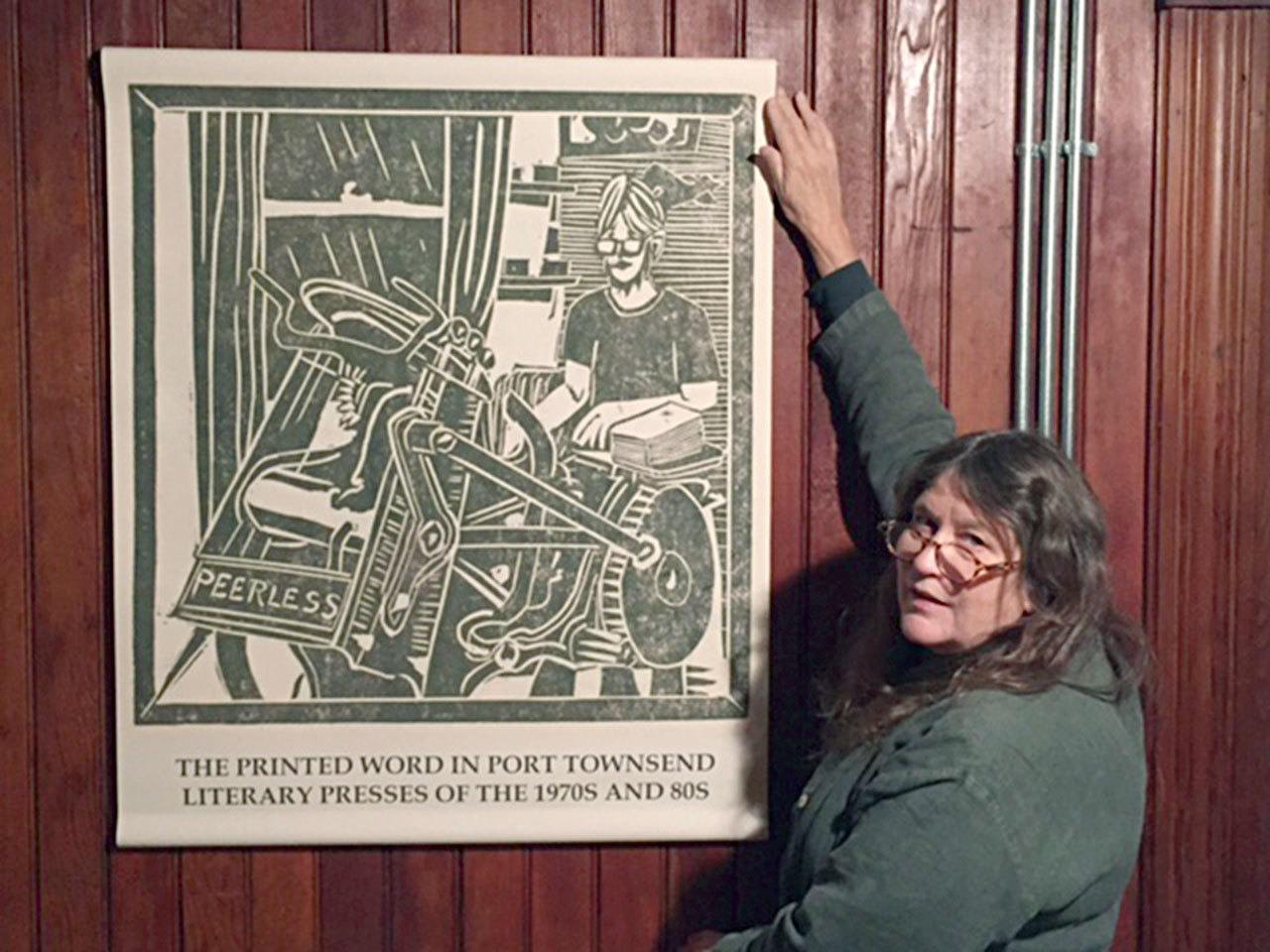 Co-curator Jenny Westdal mounts a display for the Jefferson Museum of Art & History’s new exhibit, “Printed Word in Port Townsend: Literary Presses of the 1970s and ’80s.”