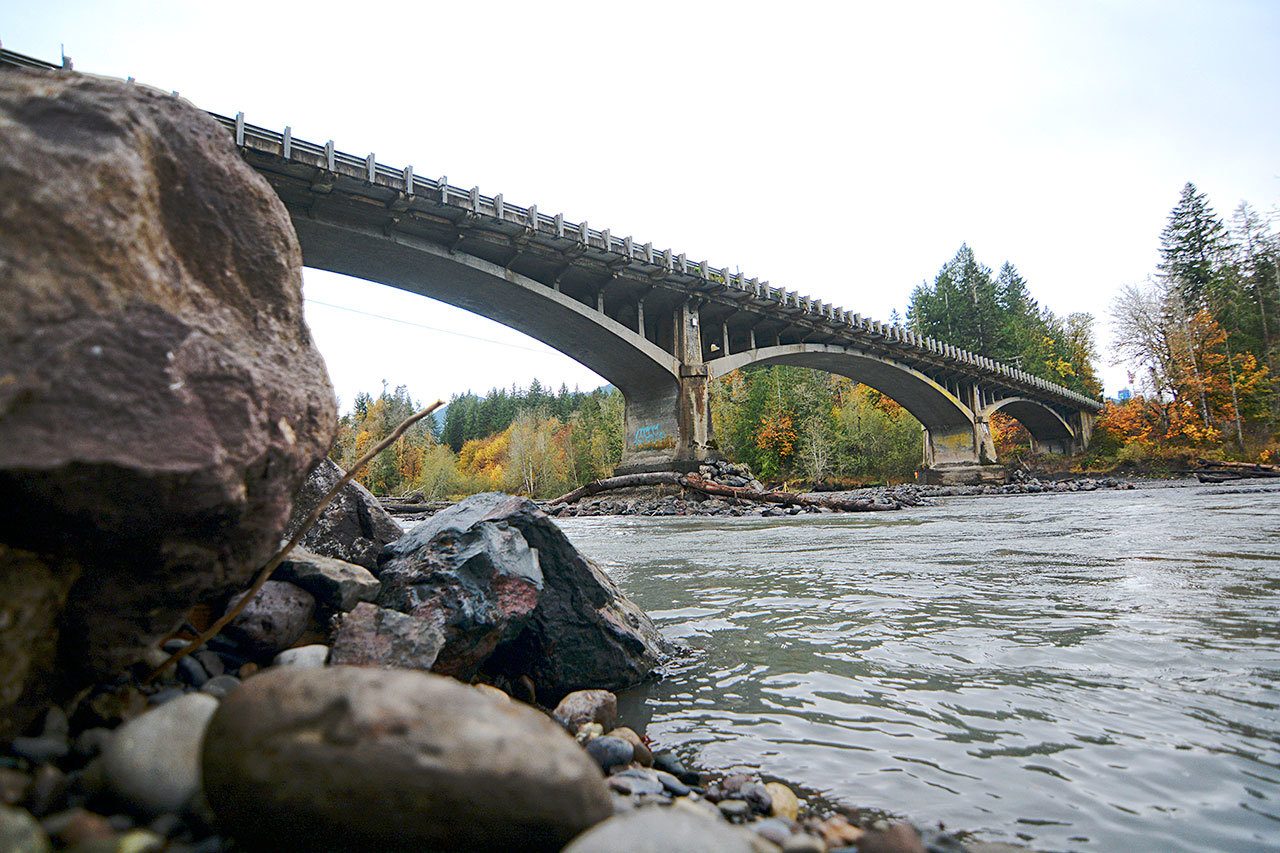 The state Department of Transportation is exploring options for the Elwha River bridge on U.S. Highway 101 west of Port Angeles as the now-wild river continues to eat away at the riverbed under the bridge. (Jesse Major/Peninsula Daily News)