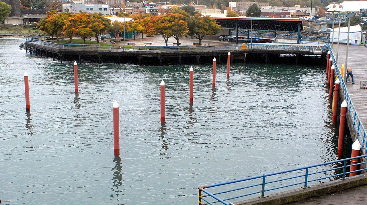 Pilings that once supported seasonal-moorage docks at Port Angeles City Pier have been empty since the end of the 2012 boating season, when the old floating docks were deemed to be too dilapidated to be redeployed. (Keith Thorpe/Peninsula Daily News)