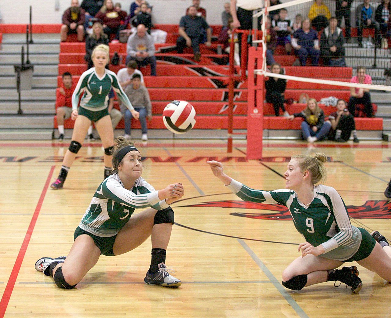 Steve Mullensky/for Peninsula Daily News Port Angeles’ Kiana Robideau (2) returns a serve and Alyssa Sweet is ready to assist during the Roughriders Olympic League 2A Division tiebreaker against Kingston.