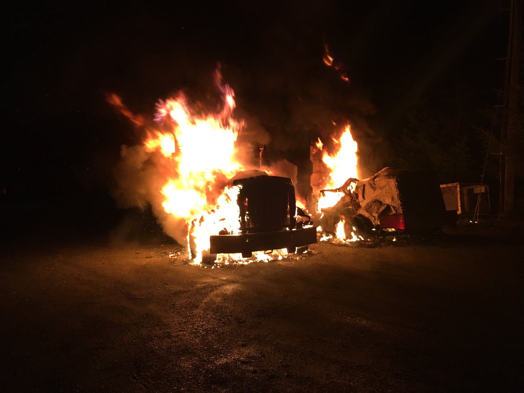 Two commercial dump trucks burn in early Friday fire