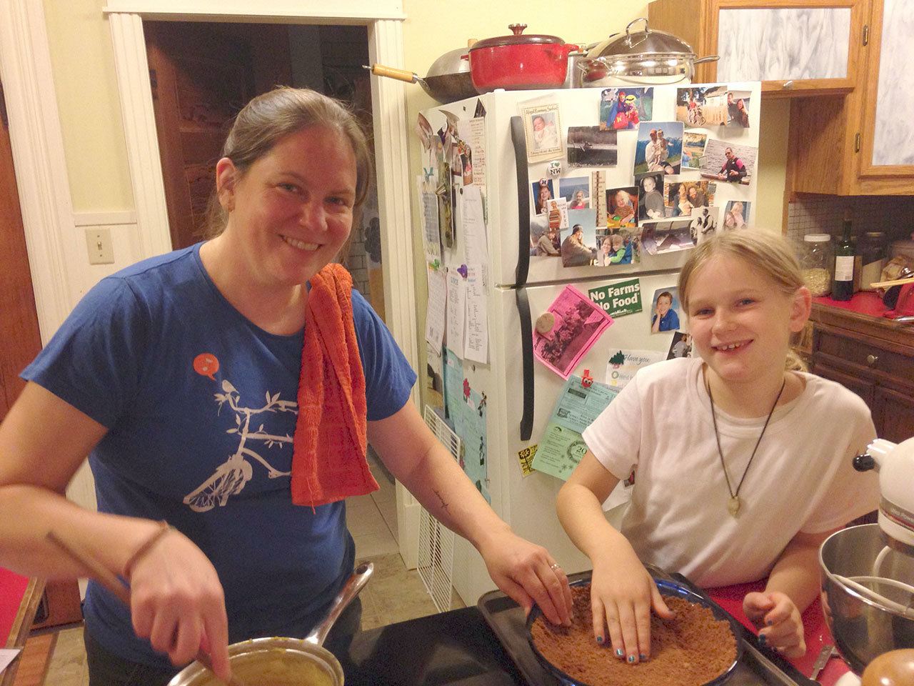 Carrie Sanford/for Peninsula Daily News                                Carrie Sanford and her daughter, Abby, prepare pies together in 2014.