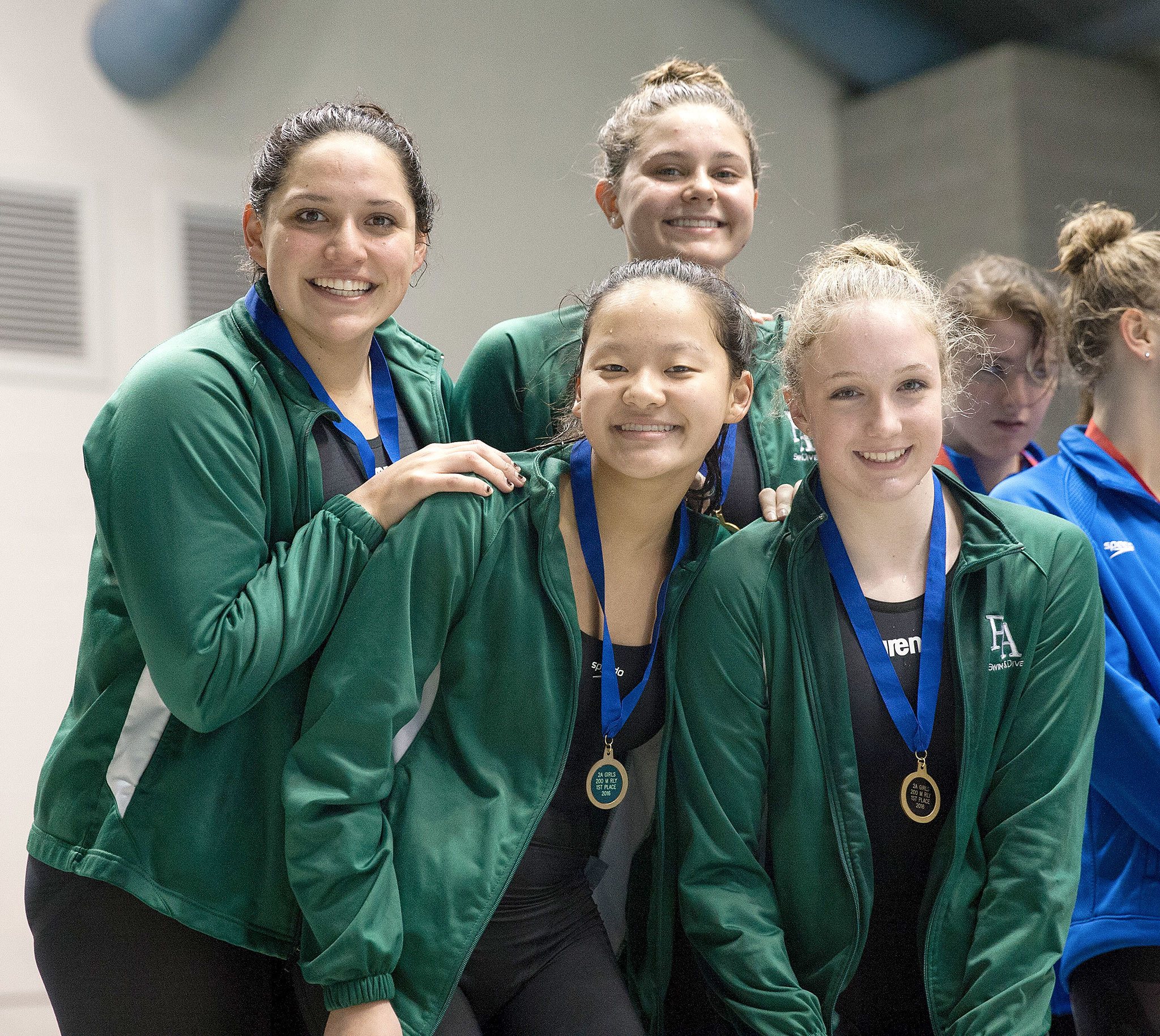 Port Angeles High School photo                                Port Angeles’ 200 medley relay team celebrates winning first place at the State 2A Swim and Dive Championships Saturday. The relay team is Jaine Macias, Felicia Che, Nadia Cole and Kenzie Johnson.