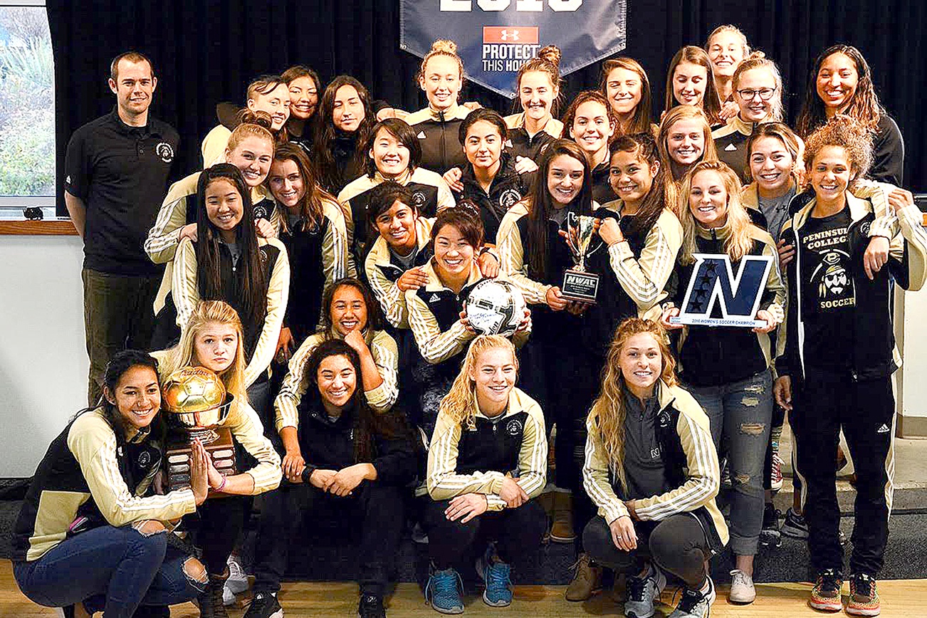 Jay Cline/for Peninsula Daily News The Peninsula College women’s soccer team was feted by Peninsula College at The Pirate Union Building after winning the Northwest Athletic Conference championship over the weekend for the program’s third title in six seasons. The women went 19-1-1 this season and beat Highline 1-0 in the 103rd minute in double overtime on a goal by Bri Vallente. As part of the celebration, coach Kanyon Anderson, standing at left, had his head shaved by the team.