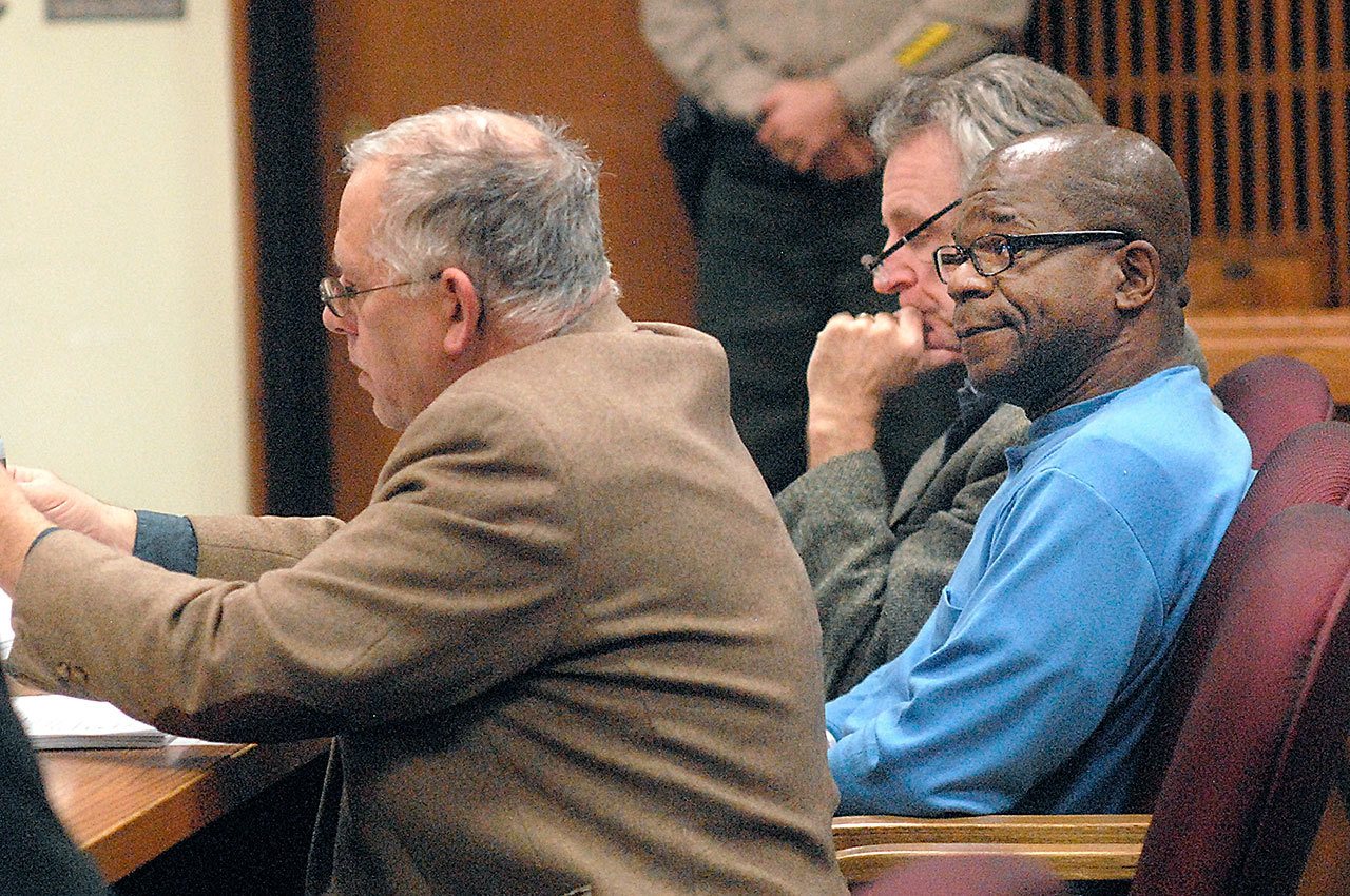 Tommy Ross Jr., right, sits with attorneys Harry Gasnick, left, and John Hayden during Ross’ first appearance in Clallam County Superior Court on Wednesday in connection with the 1978 murder of Janet Bowcutt. (Keith Thorpe/Peninsula Daily News)