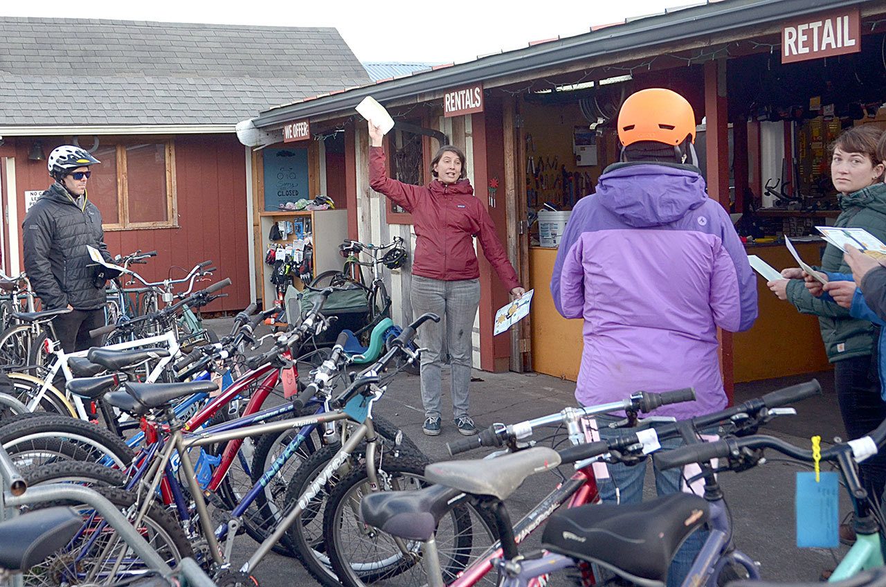 Nhatt Nichols of The ReCyclery in Port Townsend explains the rules of Cranksgiving to participants Saturday afternoon. (Cydney McFarland/Peninsula Daily News)