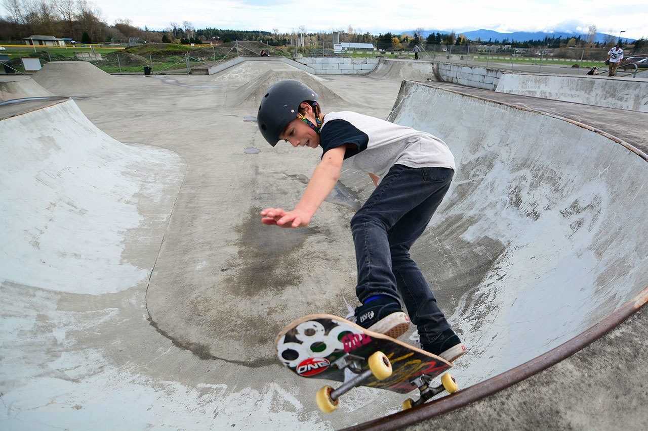 Cannon Cummins, 12, skateboards in one of the bowls at the Sequim skate park on Sunday. (Jesse Major/Peninsula Daily News)