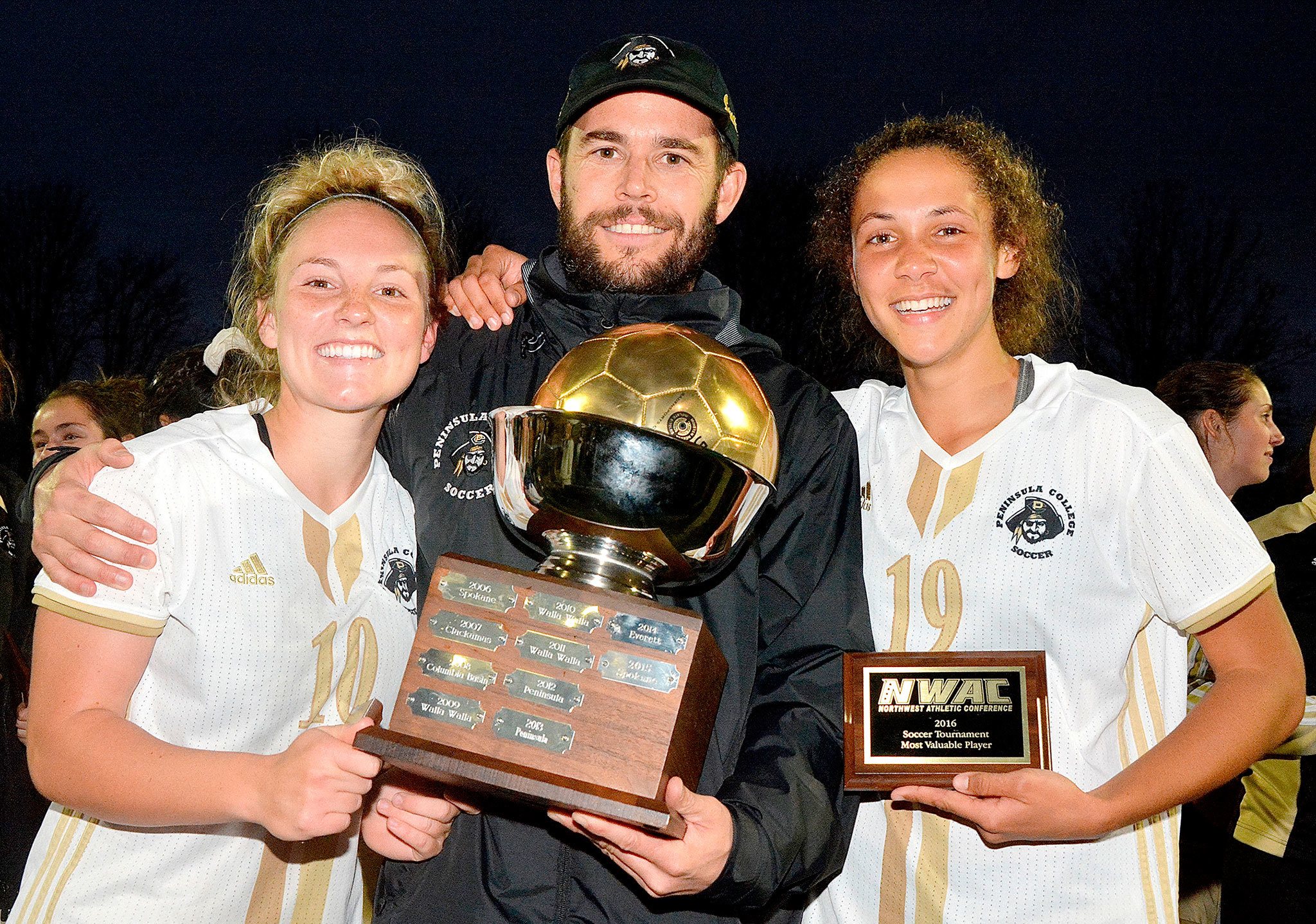 Peninsula College photo                                Peninsula women’s soccer coach Kanyon Anderson celebrates the Pirates’ NWAC championship Nov. 13 in Tukwila with players Kennady Whitehead, left, and Bri Valiente.