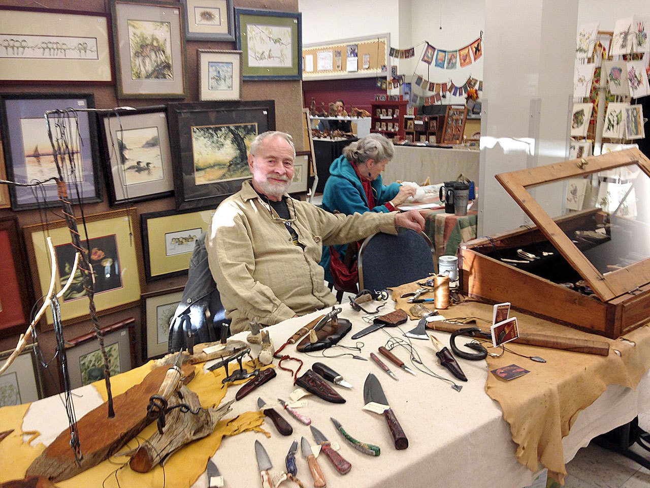 Jim Stewart, left, and Vicki Wickell sell items during the 2015 Holiday Arts and Crafts Fair. (Port Townsend Arts Guild)