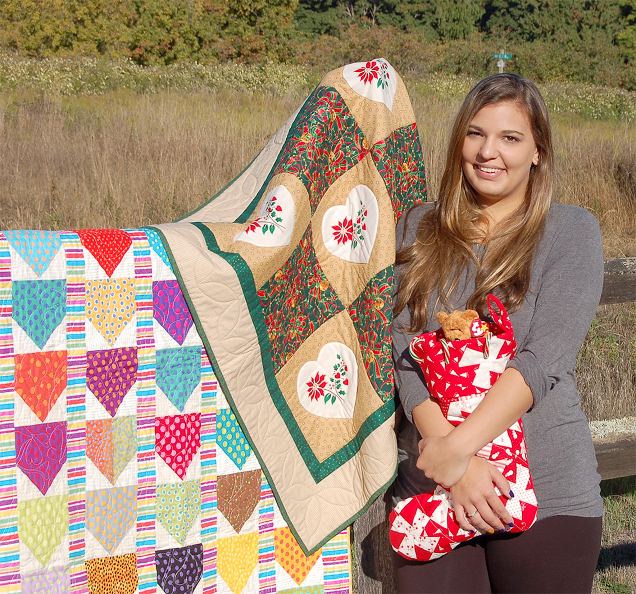 Shirley Stauffer                                Tickets for quilted raffle items, crafted by the Sunbonnet Sue Quilt Club and shown with STAR Scholarship candidate Jaycee Thompson-Porrazzo of Sequim, can be purchased at Saturday’s bazaar.