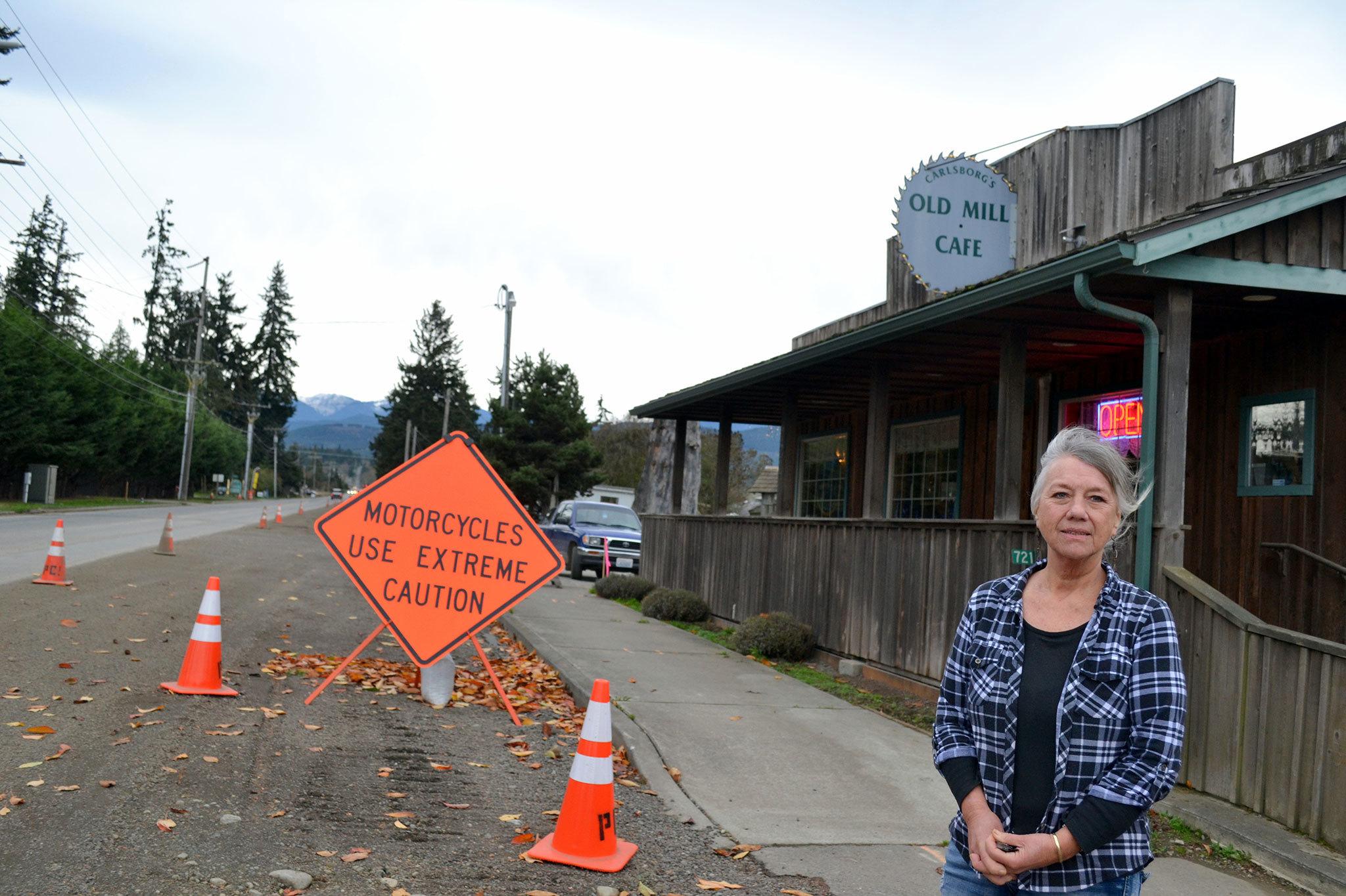 Val Culp stands outside her Old Mill Cafe on Carlsborg Road, where she says construction for the Carlsborg sewer project is deterring customers and leading her to lose thousands of dollars a week in sales. (Matthew Nash/Olympic Peninsula News Group)