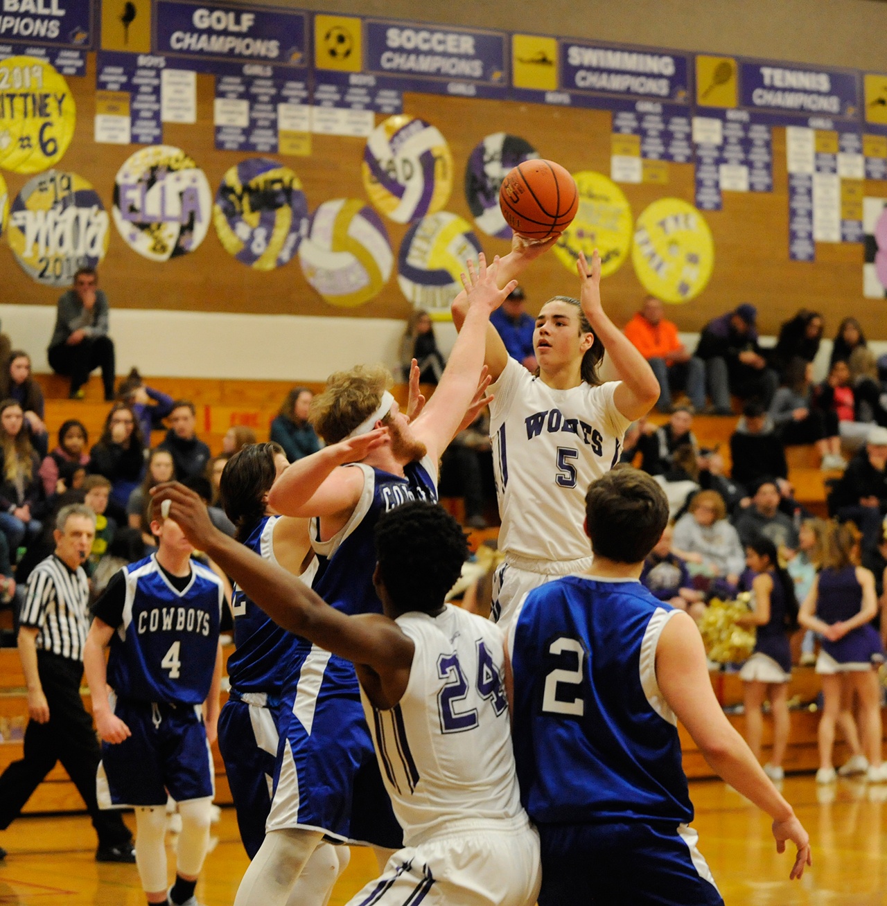 Michael Dashiell/Olympic Peninsula News Group Sequim’s Payton Glasser (5), rises to shoot above Chimacum’s Lane Dotson during the Wolves season-opening win.