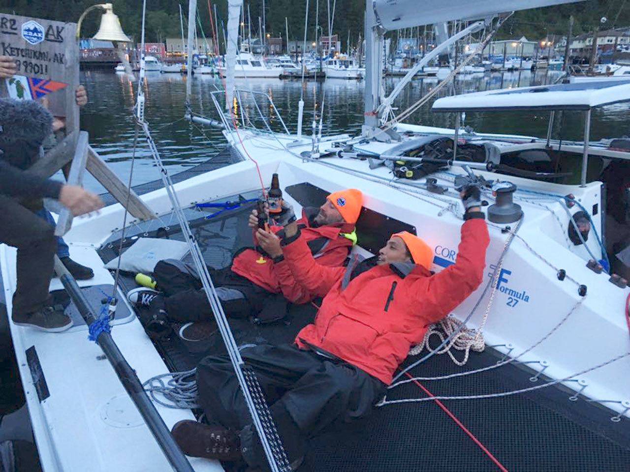 Zach Tapac and Spike Kane celebrate their arrival in Ketchikan after unofficially completing the Race to Alaska in 2016. Tapac and Kane were part of the original Team Alula crew and are both paralyzed from their armpits down due to neck injuries. (Daniel Evens/R2AK)