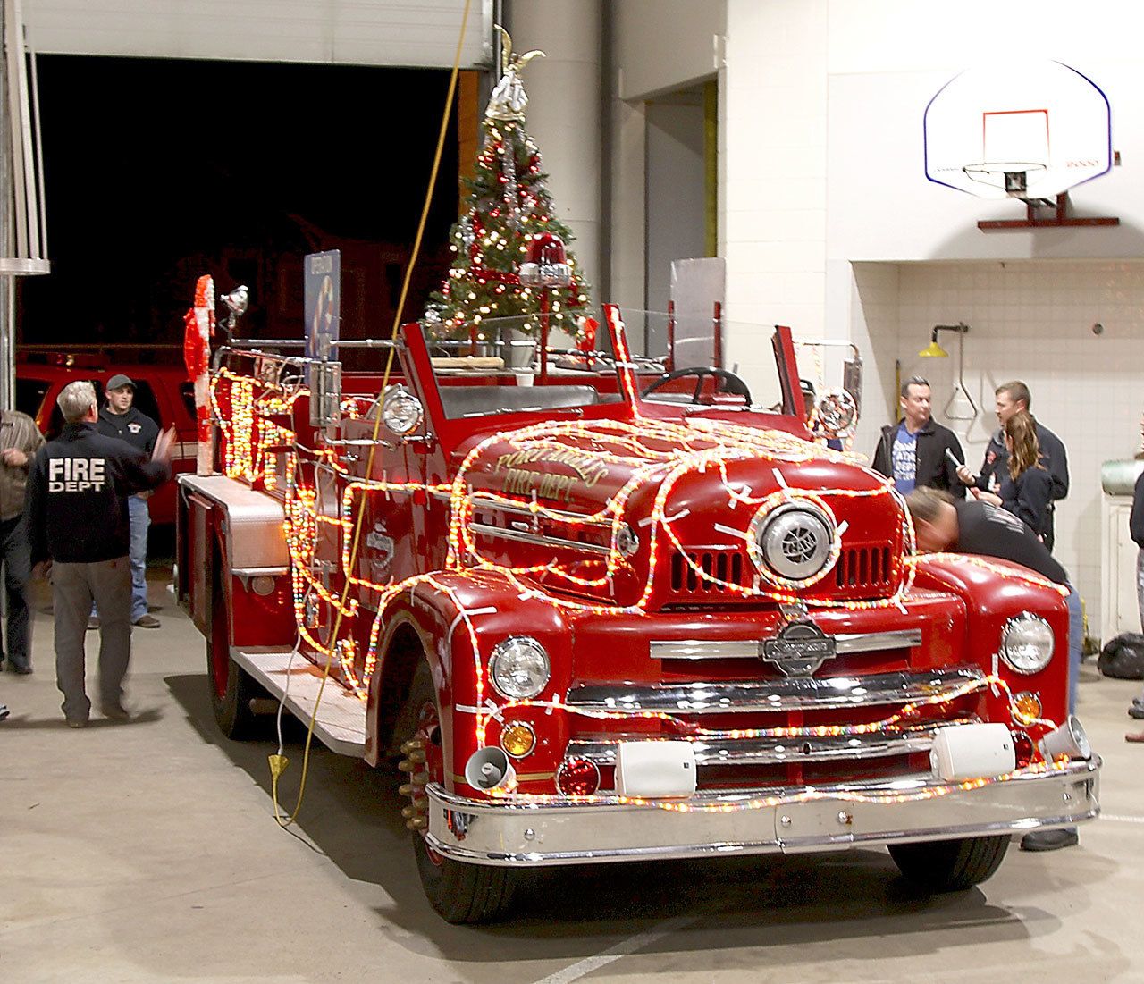 An antique fire engine known as Sparky is decorated last week for the Port Angeles Fire Department’s 32nd annual Operation Candy Cane, which is in progress each evening through Thursday. (Dave Logan/for Peninsula Daily News)
