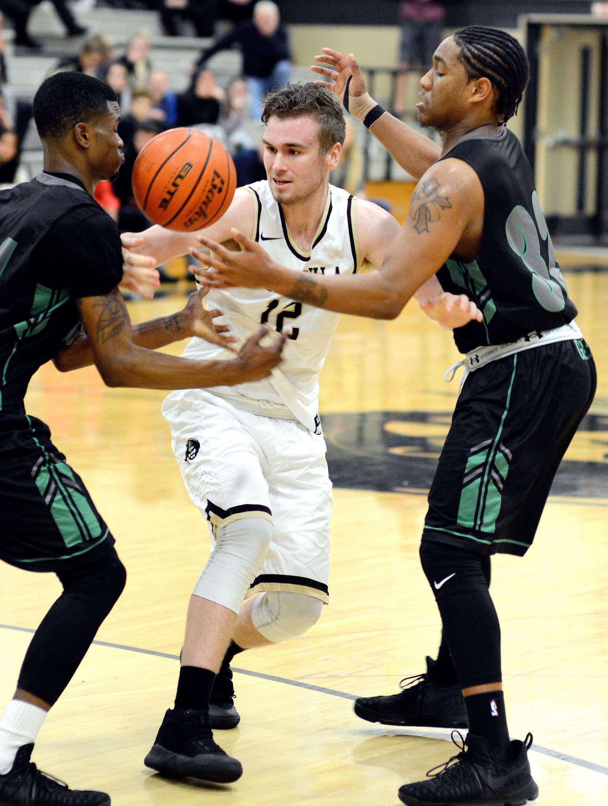 Rick Ross/Peninsula College Peninsula’s Trent Warren fights out of a Green River double-team in the Pirates’ 82-76 win over the Gators Saturday night.