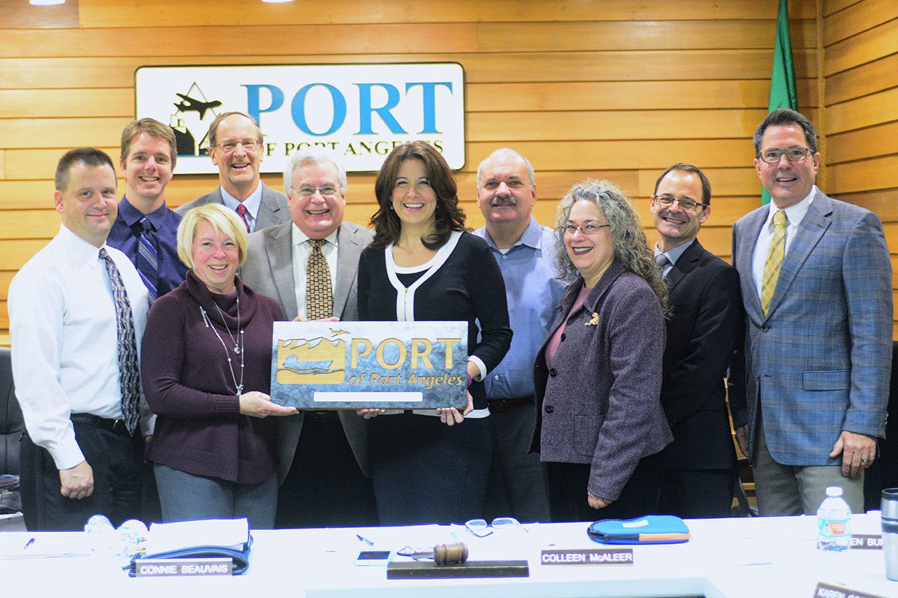 The Composite Recycling Technology Center presented the Port of Port Angeles a plaque for its support during a meeting Monday. (Jesse Major/Peninsula Daily News)​