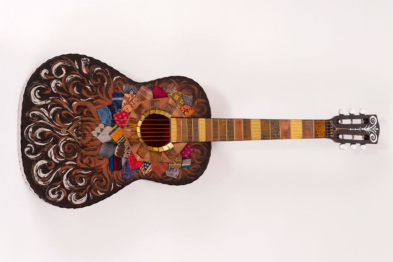 This guitar, decorated by Teri LaDow, will be on display from 5:30 p.m. to 7:30 p.m. Saturday at Studio Bob, 118 1/2 E. Front St., as part of the 2nd Weekend Art Event. (Juan de Fuca Foundation)